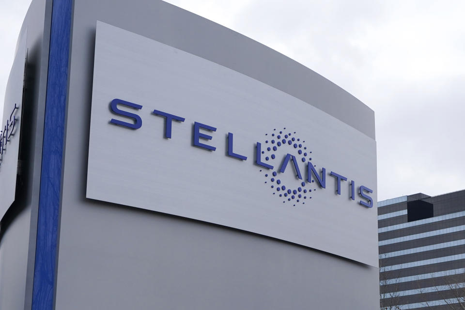 FILE - A Stellantis sign is seen outside the Chrysler Technology Center, Jan. 19, 2021, in Auburn Hills, Mich. Stellantis says that when it starts to sell compact and midsize electric vehicles off new underpinnings next year, they will be able to go up to 435 miles (700 kilometers) per charge. The company made the claim Wednesday, July 5, 2023, as it unveiled its new medium-sized platform designed for the purpose of housing battery packs and electric drive trains. (AP Photo/Carlos Osorio, File)