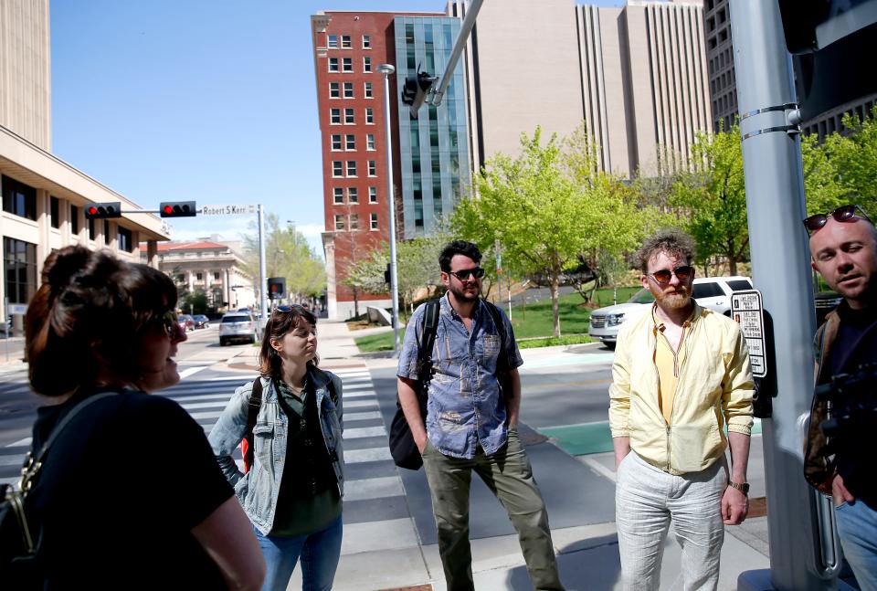 From left, Kelly Kerwin, Emily Zemba, Tyler Kieffer, Kevin McNamara and Hugh Farrell walk the path of the immersive audio tour that will be offered with Oklahoma City Repertory Theatre's "Of a Mind: Oklahoma City" in Oklahoma City, Friday, April, 15, 2022.