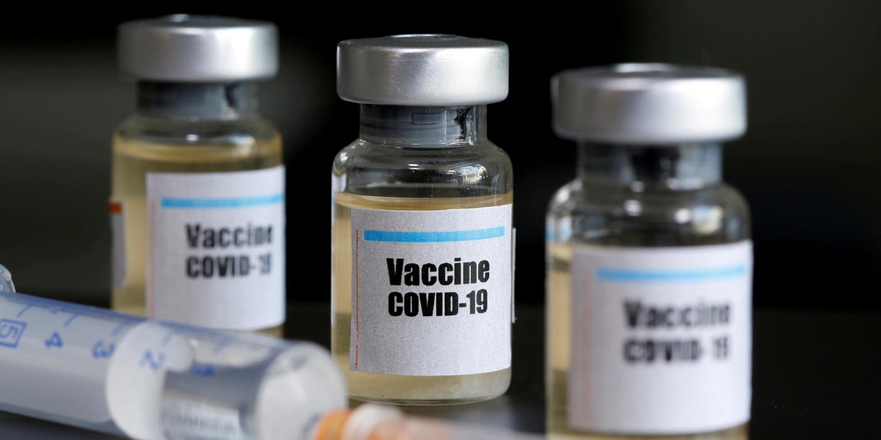 FILE PHOTO: Small bottles labbeled with a "Vaccine COVID-19" sticker and a medical syringe are seen in this illustration taken taken April 10, 2020. REUTERS/Dado Ruvic/Illustration