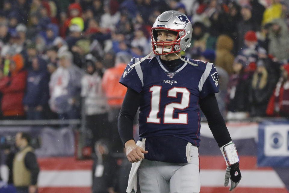 FILE - In this Saturday, Jan. 4, 2020 file photo, New England Patriots quarterback Tom Brady walks to the sideline after throwing an interception late in the second half of an NFL wild-card playoff football game against the Tennessee Titans in Foxborough, Mass. Nearly every one of the NFL's eight divisions has a team or teams with a quarterback quandary. With the exception of the NFC West it's easy to argue that there's a major hole behind center somewhere. Yep, after two decades of unmatched success, Tom Brady is without a contract. (AP Photo/Bill Sikes, File)