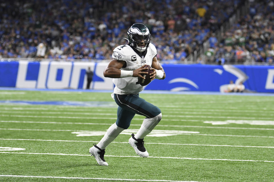 Philadelphia Eagles quarterback Jalen Hurts (1) runs the ball against the Detroit Lions in the first half of an NFL football game in Detroit, Sunday, Sept. 11, 2022. (AP Photo/Lon Horwedel)