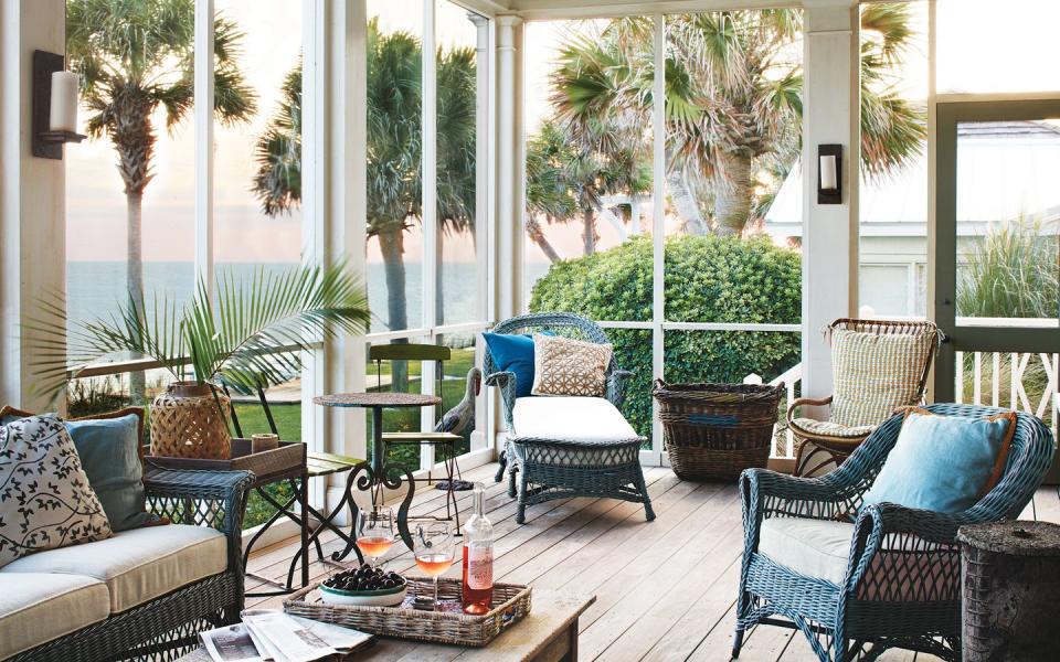 screened in porch with ocean view