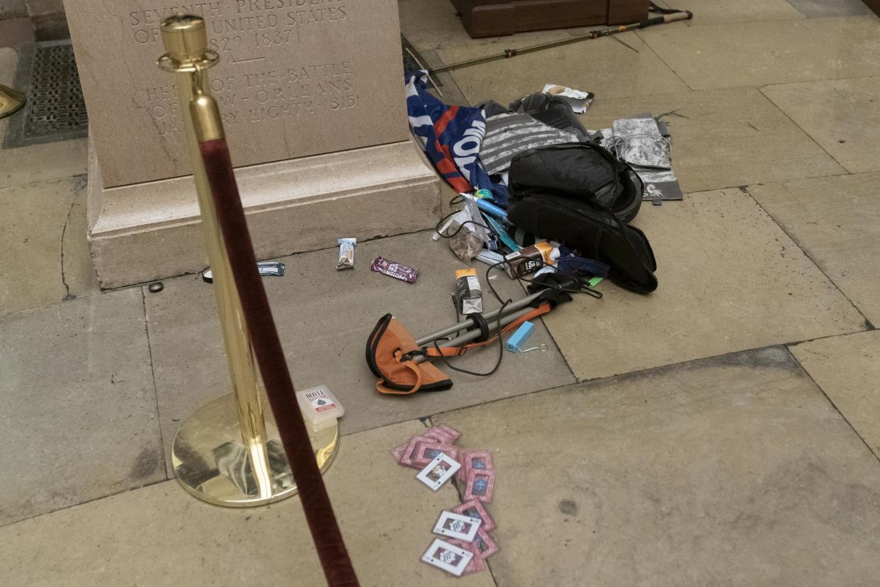 Debris and personal belongings are strewn across the floor of the Rotunda in the early morning hours after protesters stormed the Capitol on Wednesday in Washington, Thursday, Jan. 7, 2021.