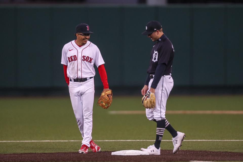 Boston Red Sox shortstop David Hamilton, left, and Detroit Tigers infielder Kody Clemens, right, talk at second base during the annual Texas Alumni baseball game on Feb. 5, 2022. The Texas alumni team beat the Number 1 ranked Texas team 8-6.