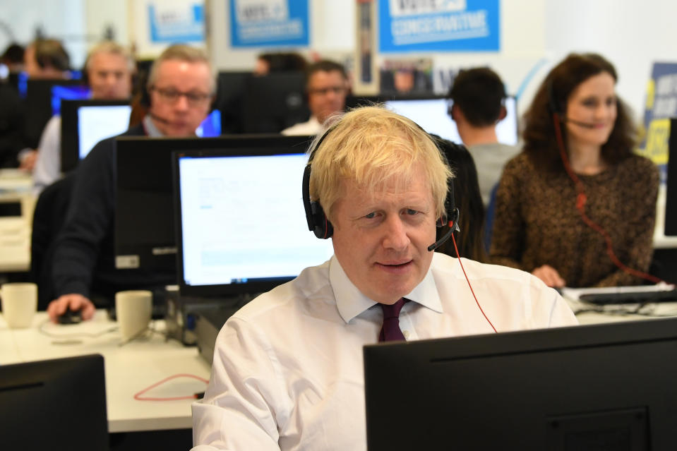 Prime Minister Boris Johnson with other members of his Cabinet at Conservative Campaign Headquarters Call Centre, London, while on the election campaign trail.