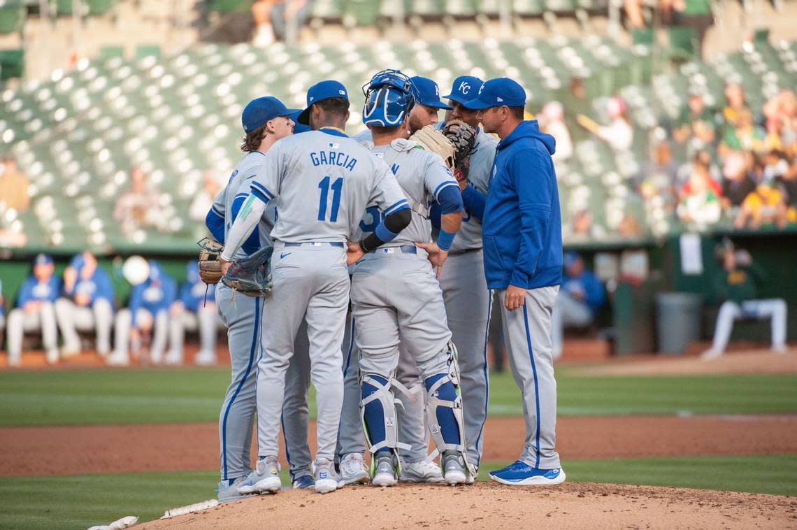 Kansas City Royals pitching coach Brian Sweeney (85) visits the mound to speak with the infield players during the third inning against the Oakland Athletics at Oakland-Alameda County Coliseum on Jun 18, 2024 in Oakland, California, USA.