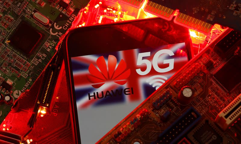 The British flag and a smartphone with a Huawei and 5G network logo are seen on a PC motherboard in this illustration