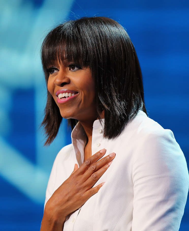 Michelle Obama sports a bangin' hairdo at the Children Gather for Kid's Inaugural Concert in 2013. (Photo: Getty Images)