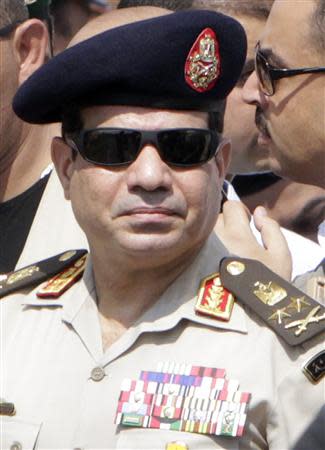 Army Chief General Abdel Fattah al-Sisi attends the military funeral service of police General Nabil Farag, who was killed on Thursday in Kerdasa, at Al-Rashdan Mosque in Cairo's Nasr City district in this September 20, 2013 file photo. REUTERS/Mohamed Abd El Ghany/Files