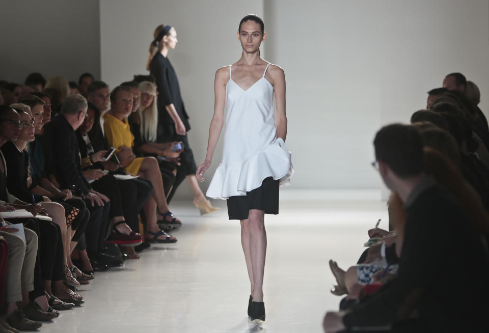 Fashion from the Victoria Beckham Spring 2014 collection is modeled on Sunday, Sept. 8, 2013 in New York. (AP Photo/Bebeto Matthews)