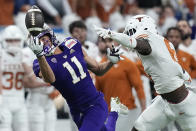 Washington wide receiver Jalen McMillan (11) fails to make a catch in front of Texas defensive back Ryan Watts (6) during the first half of the Alamo Bowl NCAA college football game in San Antonio, Thursday, Dec. 29, 2022. (AP Photo/Eric Gay)