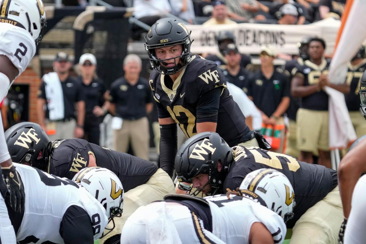 Sep 9, 2023; Winston-Salem, North Carolina, USA; Wake Forest Demon Deacons quarterback Mitch Griffis (12) looks over the Vanderbilt Commodores defense during the second quarter at Allegacy Federal Credit Union Stadium. Mandatory Credit: Jim Dedmon-USA TODAY Sports