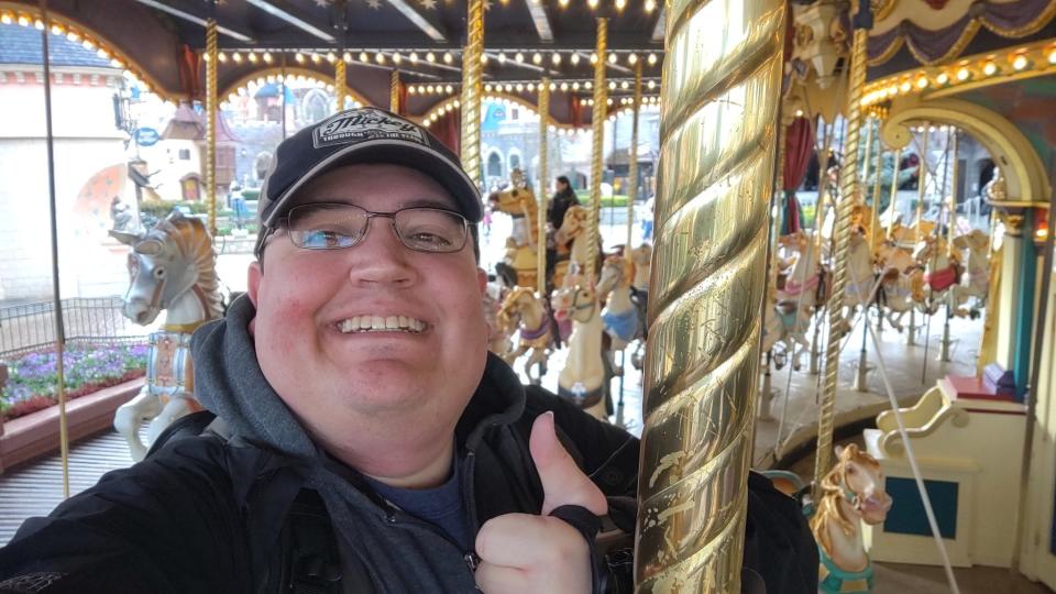 Nathan Firesheets is pictured riding Le Carousel de Lancelot at Disneyland Paris on March 8, 2023.