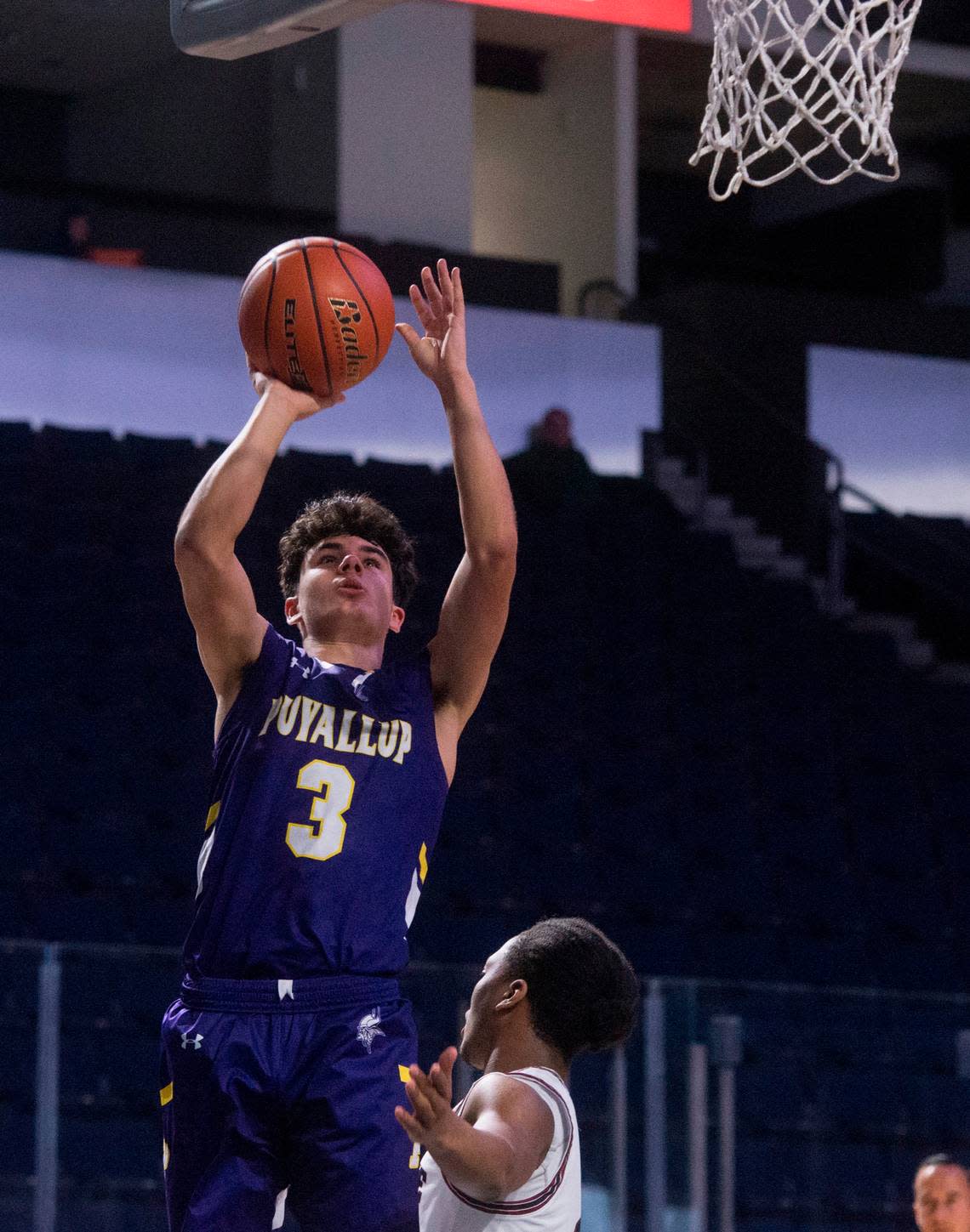 Puyallup High School guard Isaiah Sonntag puts up a shot during the fourth quarter of a basketball game against Kentlake at the 2023 King Showcase on Monday, Jan. 16, 2023 at the ShoWare Center in Kent, Wash.