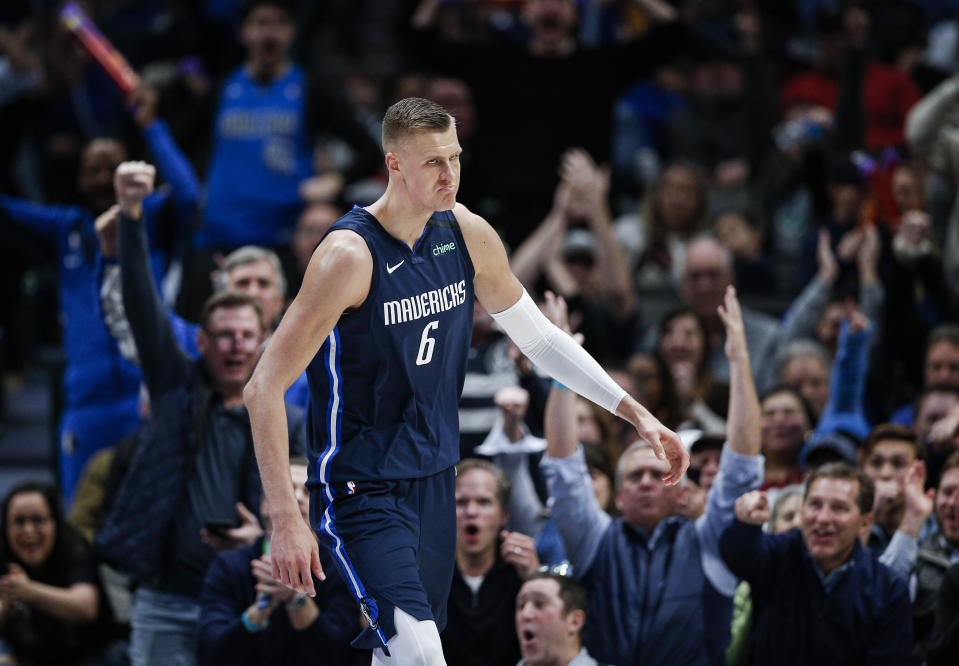 Dallas Mavericks forward Kristaps Porzingis celebrates a dunk during the second half of the team's NBA basketball game against the Sacramento Kings, Wednesday, Feb. 12, 2020, in Dallas. Dallas won 130-111. (AP Photo/Brandon Wade)