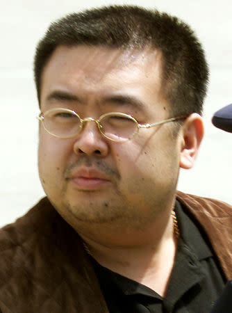 FILE PHOTO: A man believed to be North Korean heir-apparent Kim Jong Nam takes a look around as he boards a plane upon his deportation from Japan at Tokyo's Narita international airport in May 2001. REUTERS/Eriko Sugita