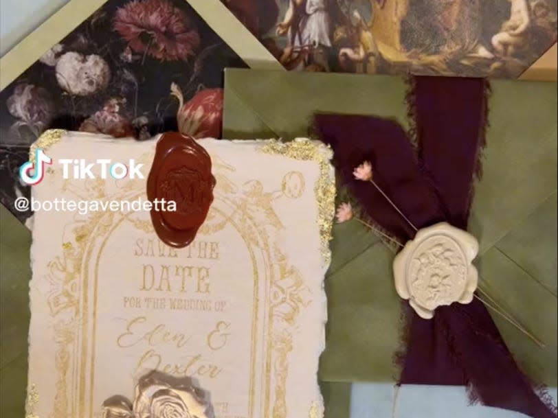screenshot of video showing the custom save-the-date cards and the envelope liners