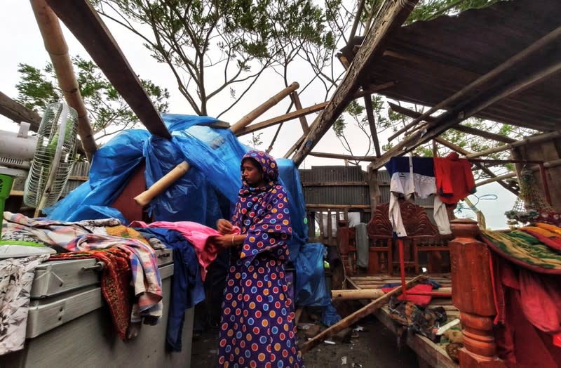 Woman is seen inside her damaged house after cyclone Bulbul hit the area in Khulna