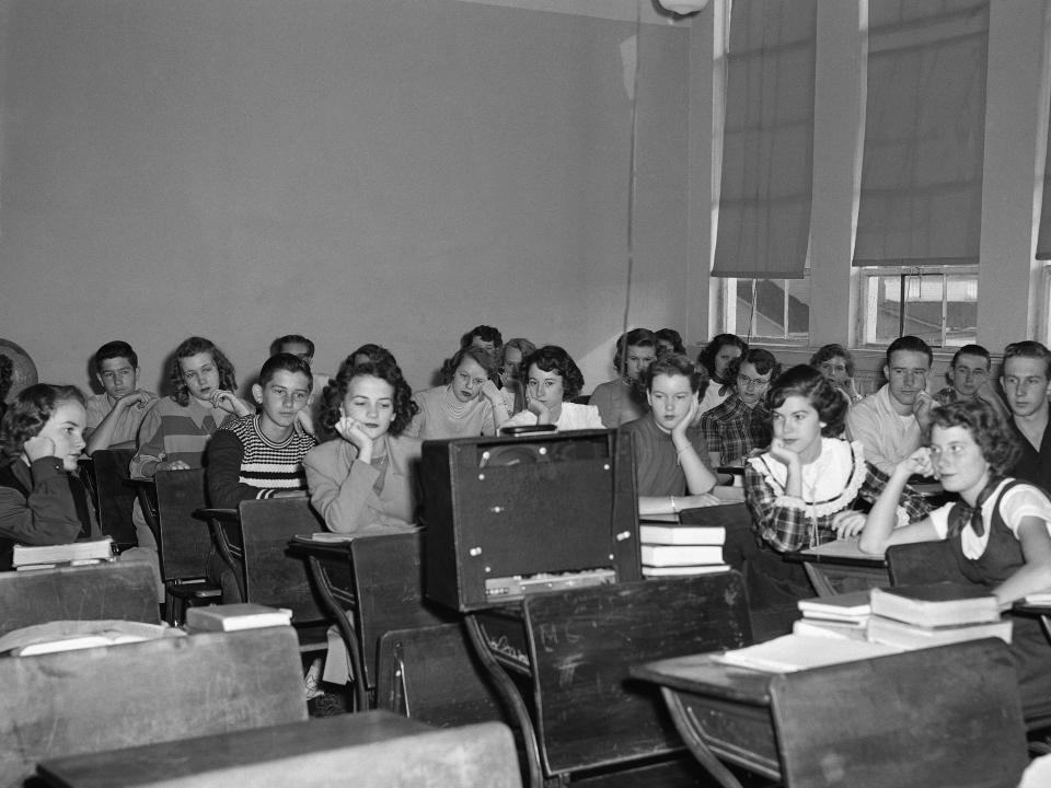 Students listening to a radio broadcast in 1950