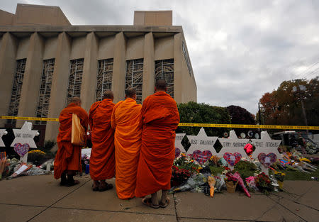 Monks pay their respects at a makeshift memorial outside the Tree of Life synagogue following Saturday's shooting at the synagogue in Pittsburgh, Pennsylvania, U.S., October 29, 2018. REUTERS/Cathal McNaughton