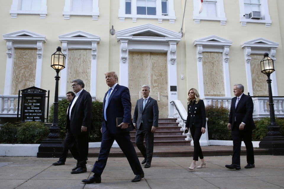 President Donald Trump departs after visiting outside St. John's Church across Lafayette Park from the White House Monday, June 1, 2020, in Washington. Part of the church was set on fire during protests on Sunday night. Walking with Trump are Defense Secretary Mark Esper, from left, Attorney General William Barr, White House national security adviser Robert O'Brien, White House press secretary Kayleigh McEnany and White House chief of staff Mark Meadows. (AP Photo/Patrick Semansky)