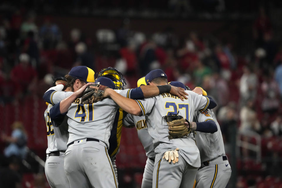 Members of the Milwaukee Brewers celebrate a 7-3 victory over the St. Louis Cardinals following a baseball game Tuesday, Sept. 19, 2023, in St. Louis. (AP Photo/Jeff Roberson)