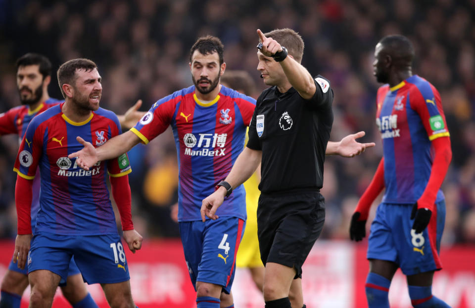 Crystal Palace’s James McArthur (left) and Luka Milivojevic appeal to referee Craig Pawson after he incorrectly gave a first-half corner