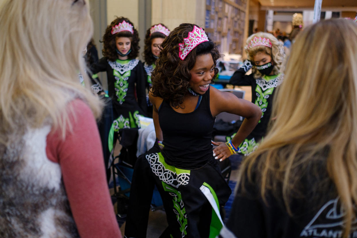 Imani Johnson tries on an outfit at competition. (Arvin Temkar for NBC News)