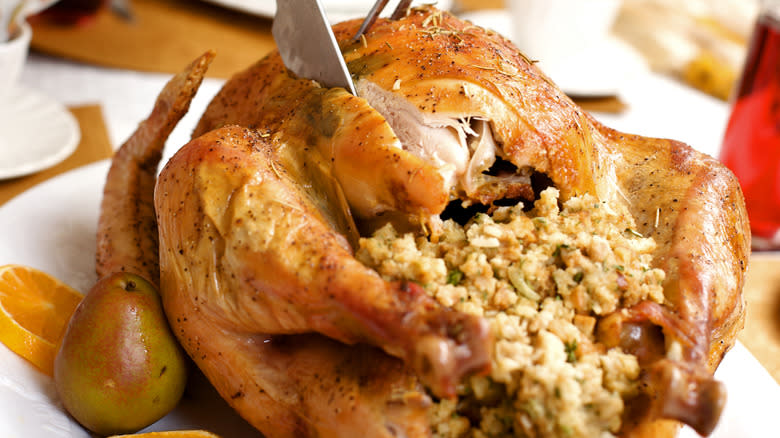 slicing chicken with stuffing