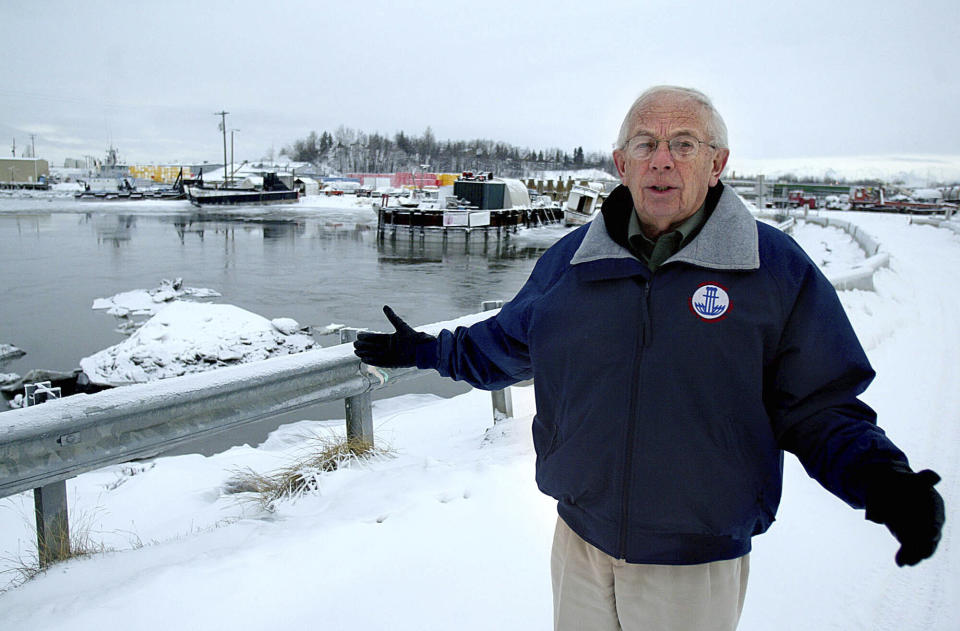 FILE - Former Alaska Gov. Bill Sheffield, who later became director of the Port of Anchorage, stands on the bridge over Ship Creek in Anchorage, Alaska, in Friday, Jan. 15, 2005. Sheffield has died. He was 94. A statement provided by friends says he died Friday, Nov. 4, 2022, at his home in Anchorage. Sheffield was governor from 1982 to 1986. (AP Photo/Al Grillo,File)