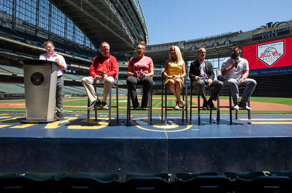 Brewers broadcaster Brian Anderson, left, guides a panel at American Family Field on Monday that includes, from left, UW men's basketball coach Greg Gard, UW women's coach Marisa Moseley, Aurora Health Care's Kelly Jo Golson, the Brewers' Rick Schlesinger and Intersport's Mark Starsiak.