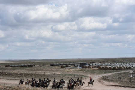 The Fort Laramie treaty riders ride along Van Tassel Road in Torrington, Wyoming, U.S., April 26, 2018. REUTERS/Stephanie Keith