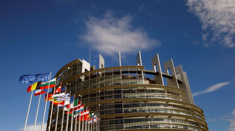 Flags of the European Union and its member states fly in front of the building of the European Parliament in Strasbourg