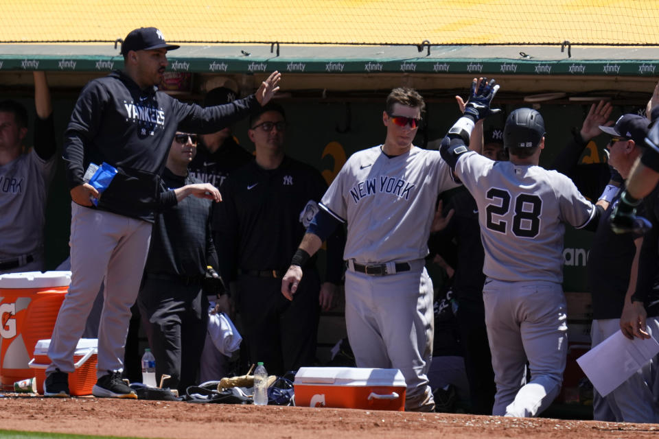New York Yankees' Josh Donaldson (28) celebrates with teammates in the dugout after hitting a two-run home run against the Oakland Athletics during the sixth inning of a baseball game in Oakland, Calif., Thursday, June 29, 2023. (AP Photo/Godofredo A. Vásquez)