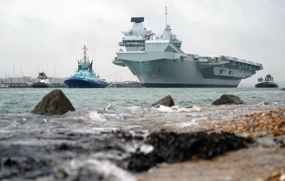 The Royal Navy aircraft carrier HMS Queen Elizabeth leaves Portsmouth Harbour (Andrew Matthews/PA Wire)