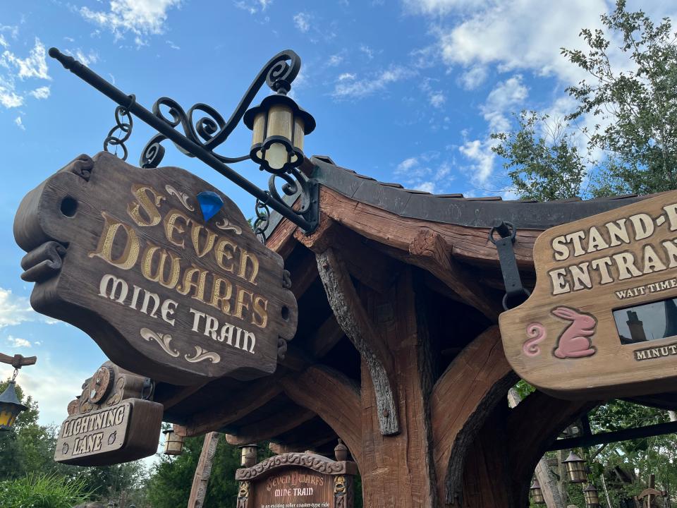 sign for seven dwarfs mine train ride at magic kingdom in disney world