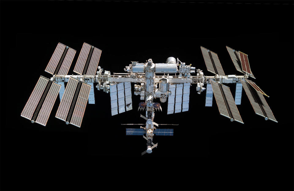 NASA is in the process of upgrading the International Space Station's solar power system. The first two of six roll-out solar array blankets were installed last year, attached to the outboard original-equipment arrays on the far right. Two roll-out arrays launched aboard the Cargo Dragon Saturday will be attached to inboard arrays on the right- and left-side of the station.  / Credit: NASA