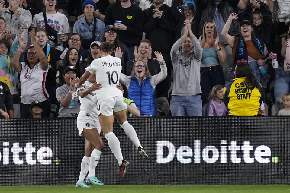 NJ/NY Gotham forward Lynn Williams (10) celebrates her goal with teammate forward Margaret Purce during the first half of the NWSL Championship soccer game against OL Reign, Saturday, Nov. 11, 2023, in San Diego. (AP Photo/Gregory Bull)