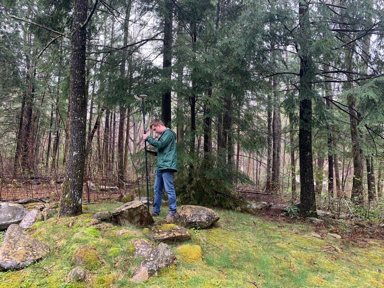 GIS and Data Management Technician Phil Abegg conducts fieldwork in the Smokies using a handheld GPS unit. Points marked in the field can be mapped onto the park’s complex geography using GIS technology.