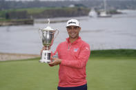 Gary Woodland posses with the trophy after winning the U.S. Open Championship golf tournament Sunday, June 16, 2019, in Pebble Beach, Calif. (AP Photo/David J. Phillip)