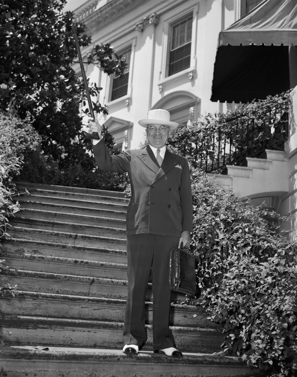 full length of harry truman waving cane