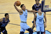 Memphis Grizzlies guard Desmond Bane (22) goes up for a dunk ahead of Sacramento Kings forward Louis King (23) in the first half of an NBA basketball game Friday, May 14, 2021, in Memphis, Tenn. (AP Photo/Brandon Dill)