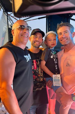 <p>FuelFest</p> Vin Diesel with Cody Walker, Caleb Walker and Caleb Walker's son Maverick Walker