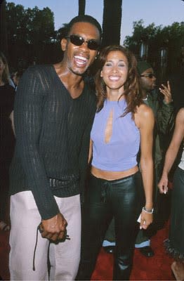 Bill Bellamy and a woman with shiny black pants at the Universal City premiere of Universal's Nutty Professor II: The Klumps