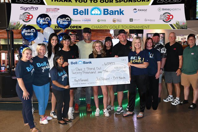 <p>BELL BANK</p> Bell Bank team members pose with actor Josh Duhamel at a Dare 2 Stand Out charity golf event in June.