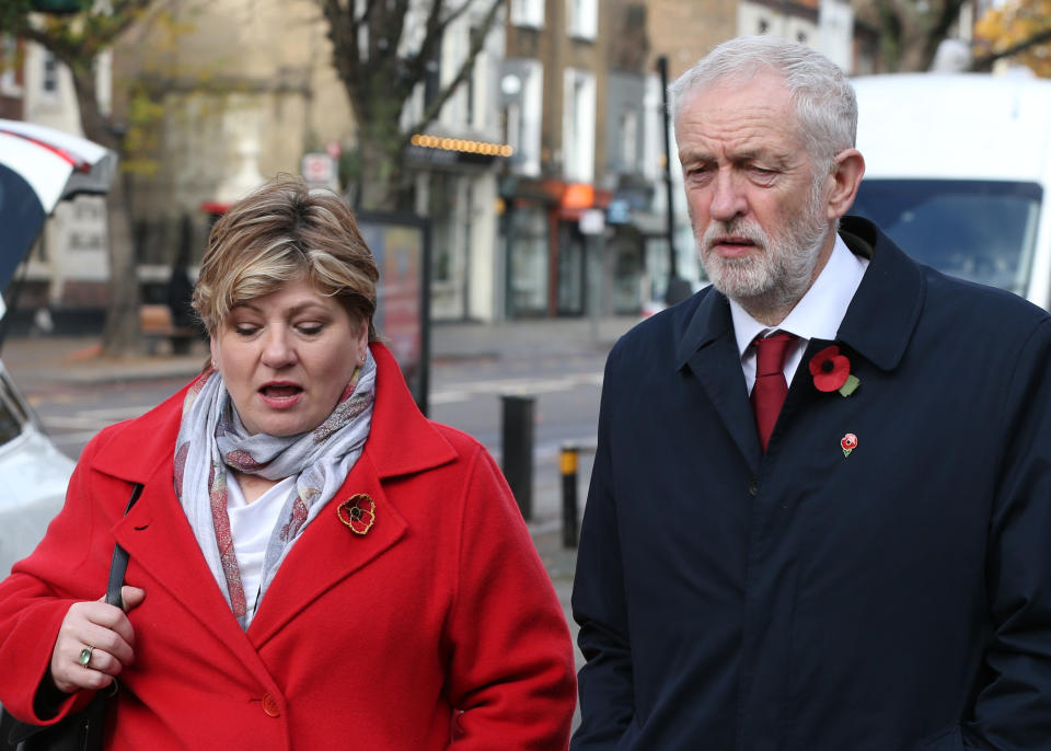 Shadow foreign secretary Emily Thornberry and Labour Party leader Jeremy Corbyn, walk together after observing a silence to mark Armistice Day, the anniversary of the end of the First World War, outside Islington Town Hall.