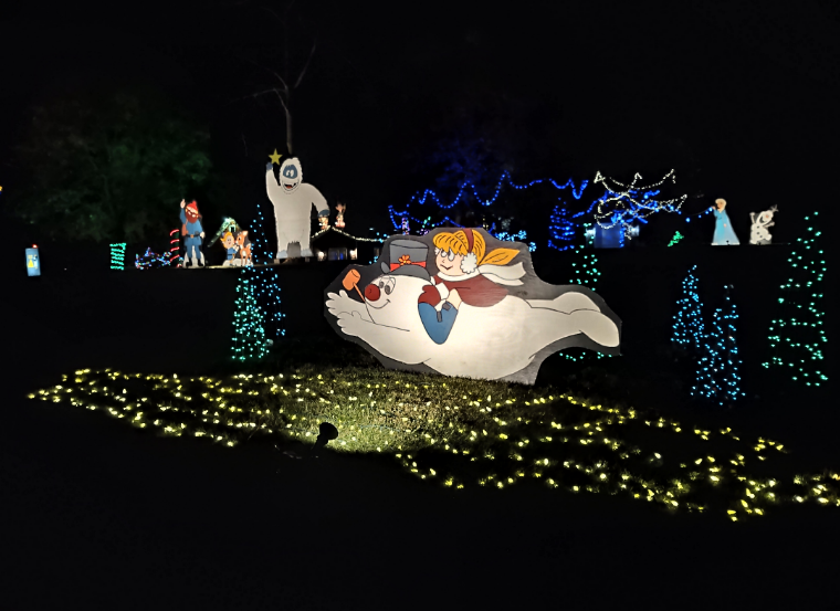 The 'Light Up Keiffer' Display at 5200 Keiffer Ave. SW in Canton Township includes thousands of lights and several family-made wooden scenes such as Frosty.