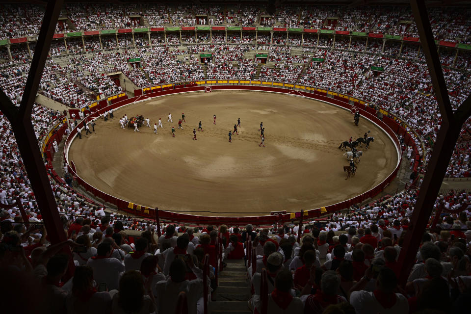 FILE - Revellers attend a bullfight during the San Fermin festival in Pamplona, Spain, Wednesday, July 6, 2022. (AP Photo/Alvaro Barrientos, File)