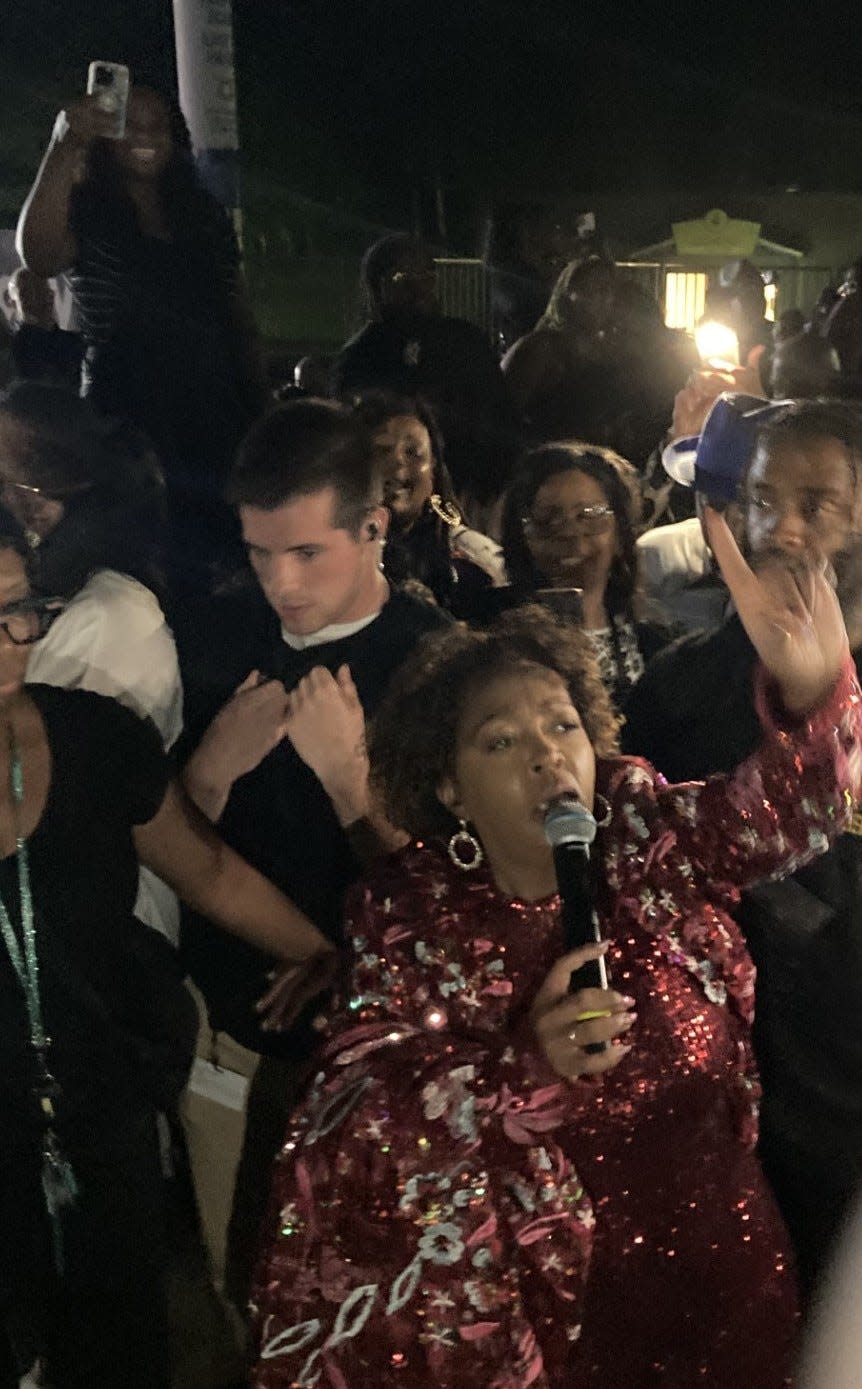 Anita Baker, surrounded by fans at a summer 2023 concert. Baker makes a rare Memphis appearance this month at FedExForum.