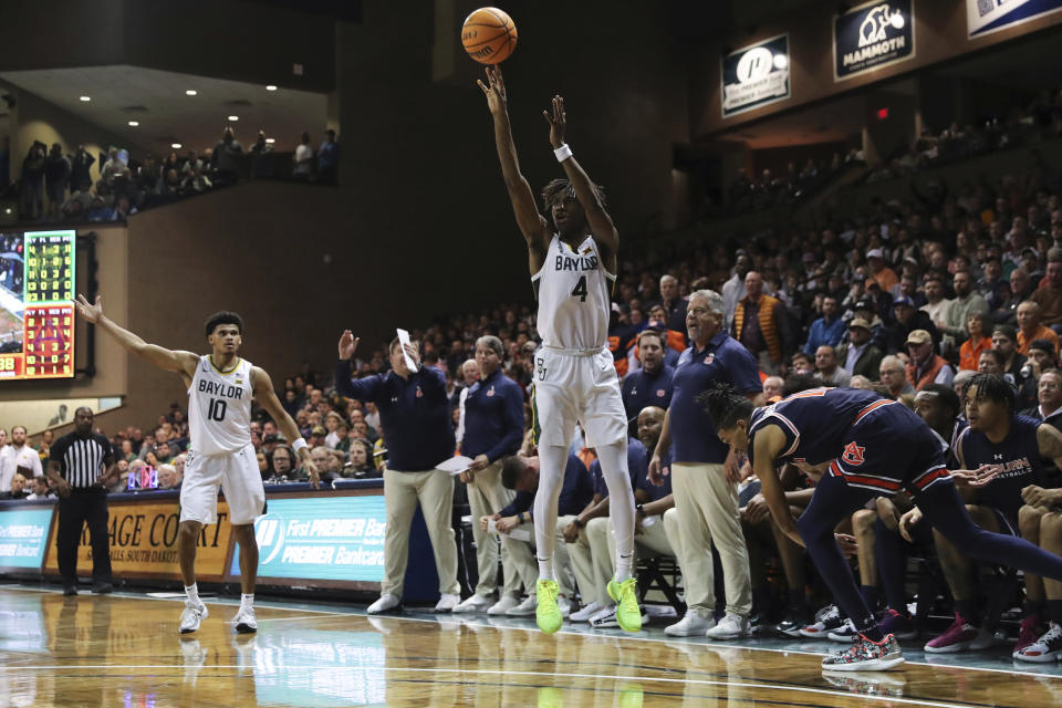 Baylor guard Ja'Kobe Walter (4) shoots a 3-point shot during an NCAA college basketball game against Auburn, Tuesday, Nov. 7, 2023, in Sioux Falls, S.D. (AP Photo/Josh Jurgens)